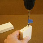 Drill holes for blind dowels in two stages. Masking tape placed on the drill bit indicates how deep it is safe to drill. 