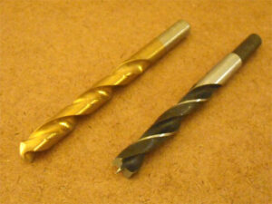 Brad point drill bits (right) are easier to position and create rounder holes compared to conventional drill bits