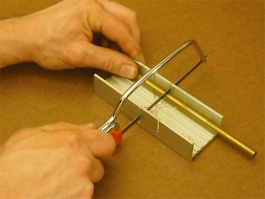 Cutting brass sheet sandwiched between two sheets of thin plywood