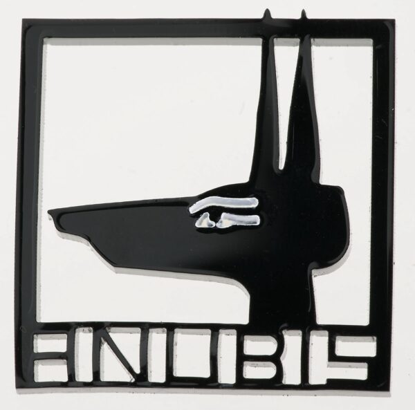 black acrylic badge laser cut in the shape of an anubis head