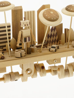 Handmade Wooden Automaton. A large robot stands in a city scene whilst flying saucers move back and forth overhead.
