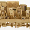 Handmade wooden automaton. 5 dancing wooden robots against a backdrop of speakers