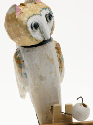 A carved wooden owl automata