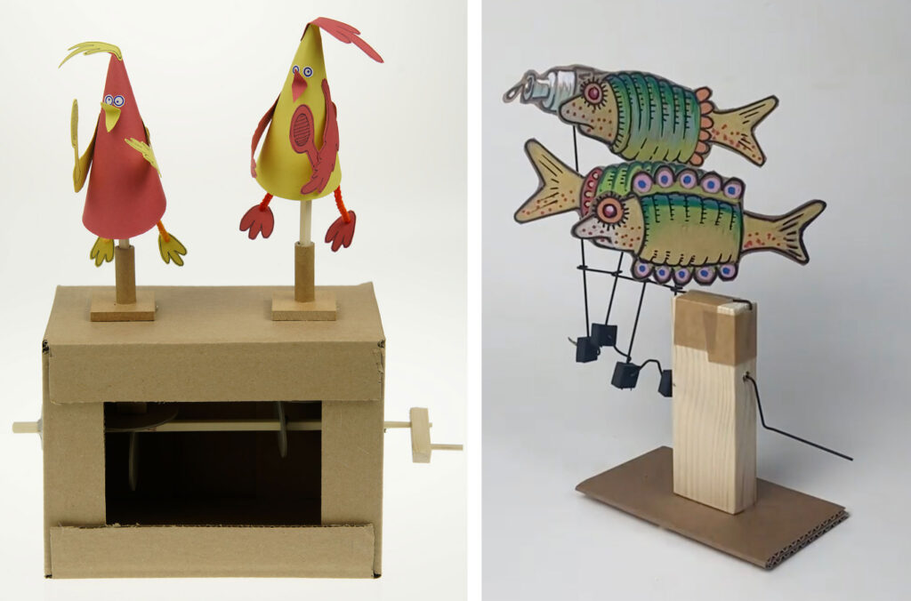 A cardboard cam kit with 2 bright birds made from red and yellow card. Left: A simple crank automaton featuring two brightly painted card fish.