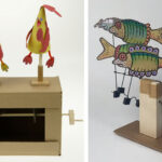 A cardboard cam kit with 2 bright birds made from red and yellow card. Left: A simple crank automaton featuring two brightly painted card fish.