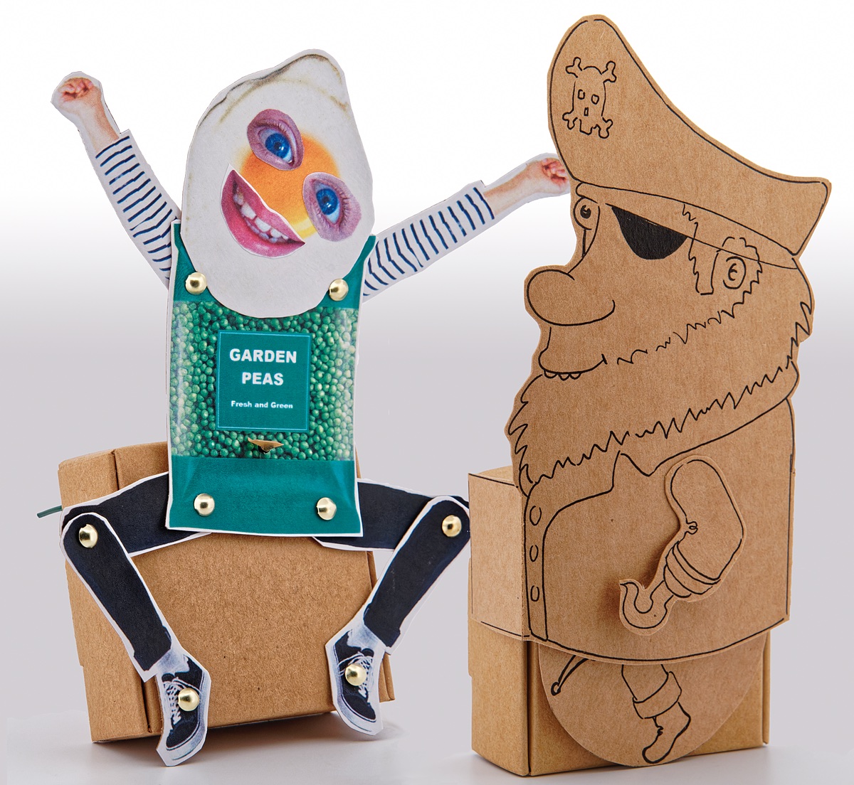 2 card automata, 1 hand drawn pirate on brown card and 1 collage character made with a bag of peas and fried egg.