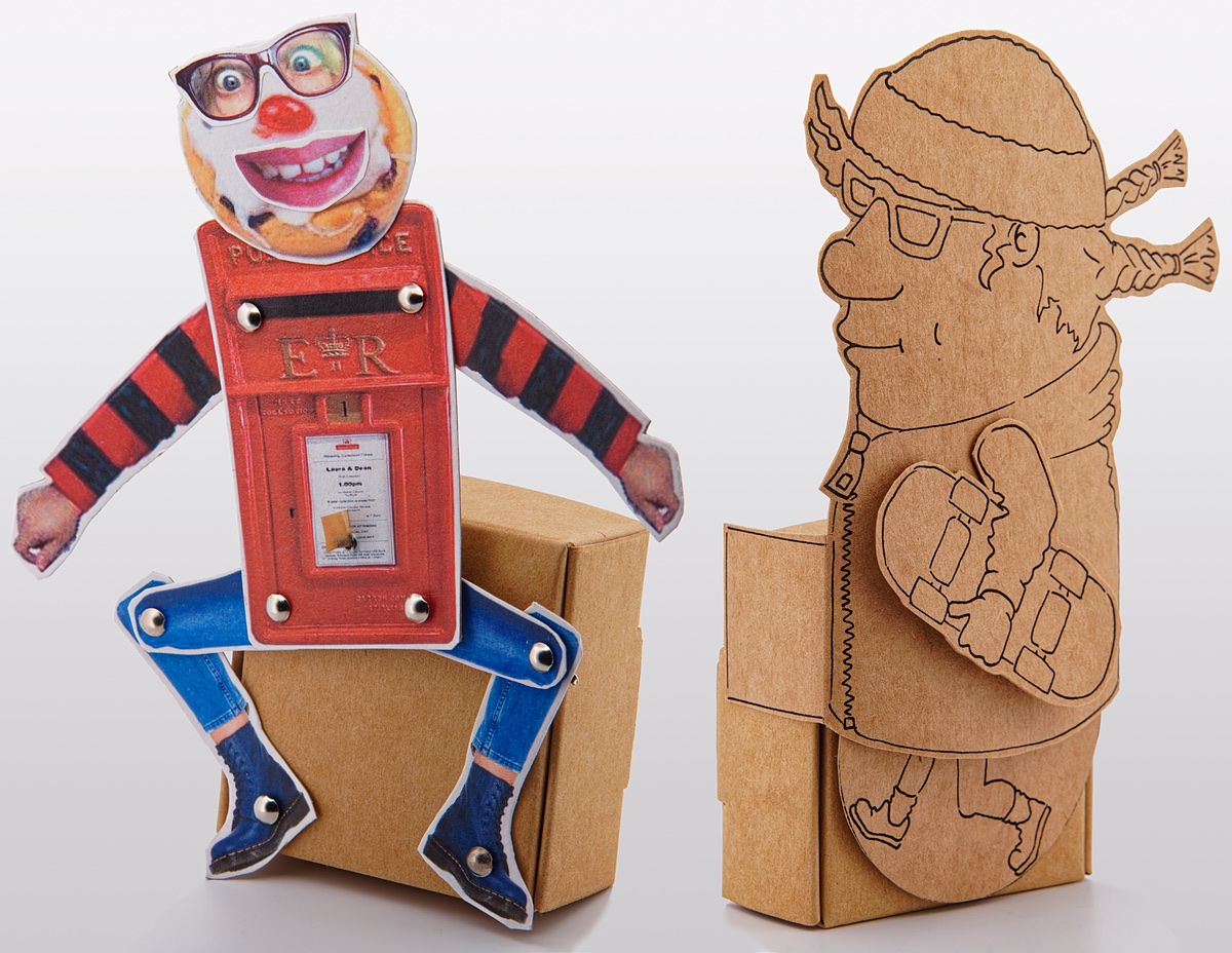 2 card automata, 1 hand drawn skater, holding skateboard with pigtails flying behind on brown card and 1 collage character made with a a postbox and cherry tart face.