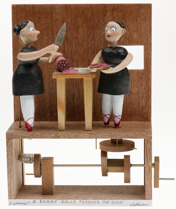 2 scary dolls slicing meat in front of a wall with a window