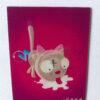 Rectangular pink magnet with cartoon image of cat lapping milk.